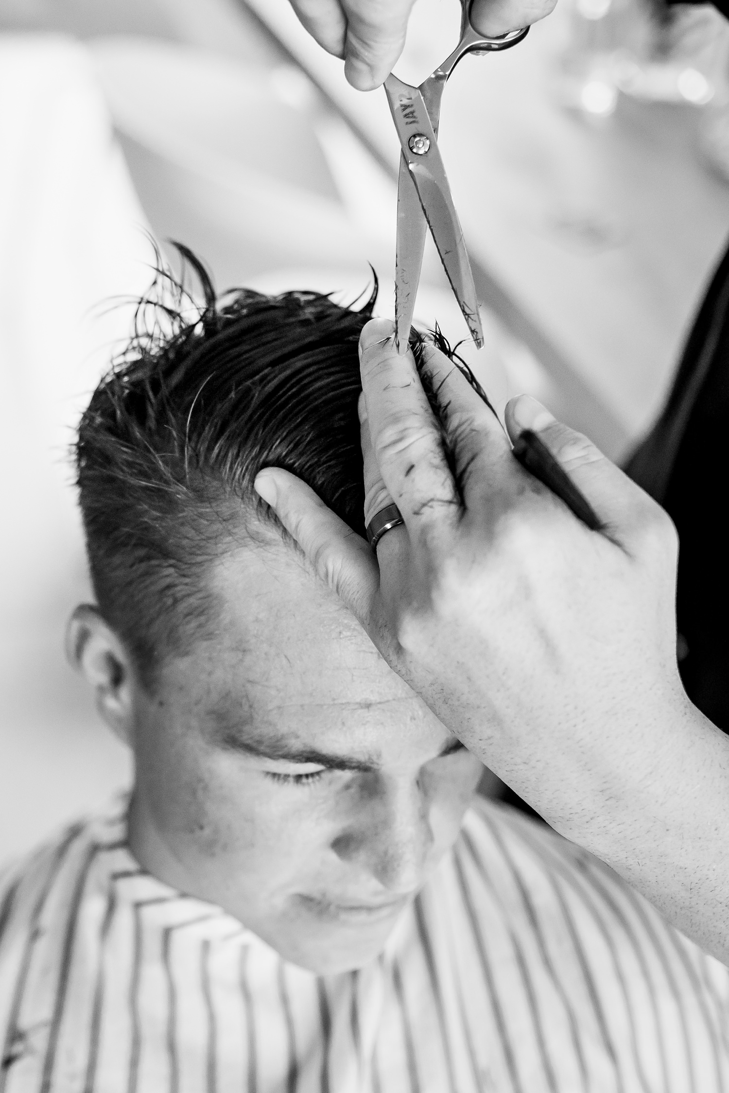 Image of Spindlers Barbers preparing to cut the grooms hair on the morning of his wedding in Port Elizabeth