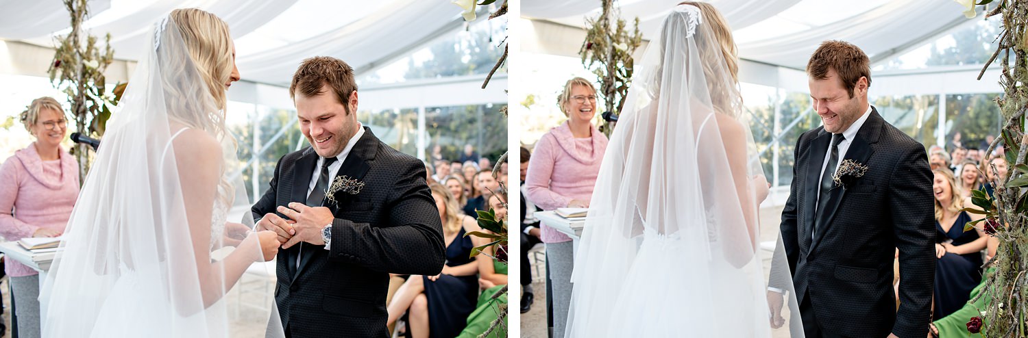 The groom pushes his ring on after it gets stuck and then laughs