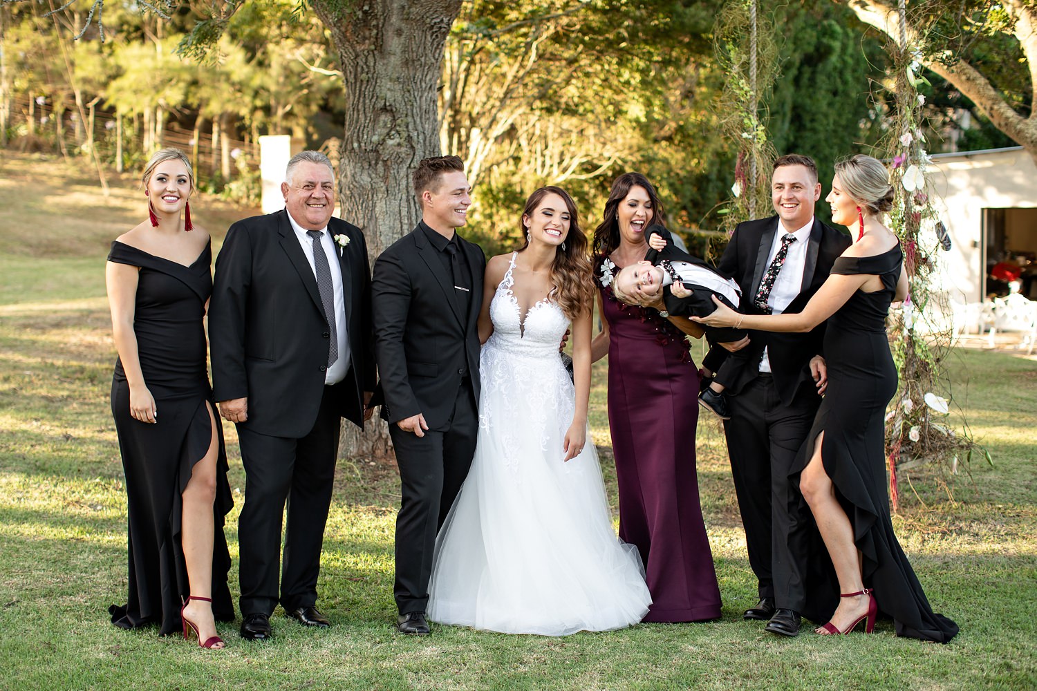 Candid family photographs with lots of laughter and happiness at the Rose Barn wedding venue by wedding photographer in South Africa, Niki M Photography