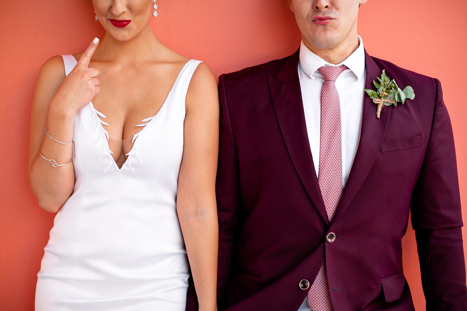 Cute photo of a bride's red lipstick rubbing off on the groom's lips after their kiss