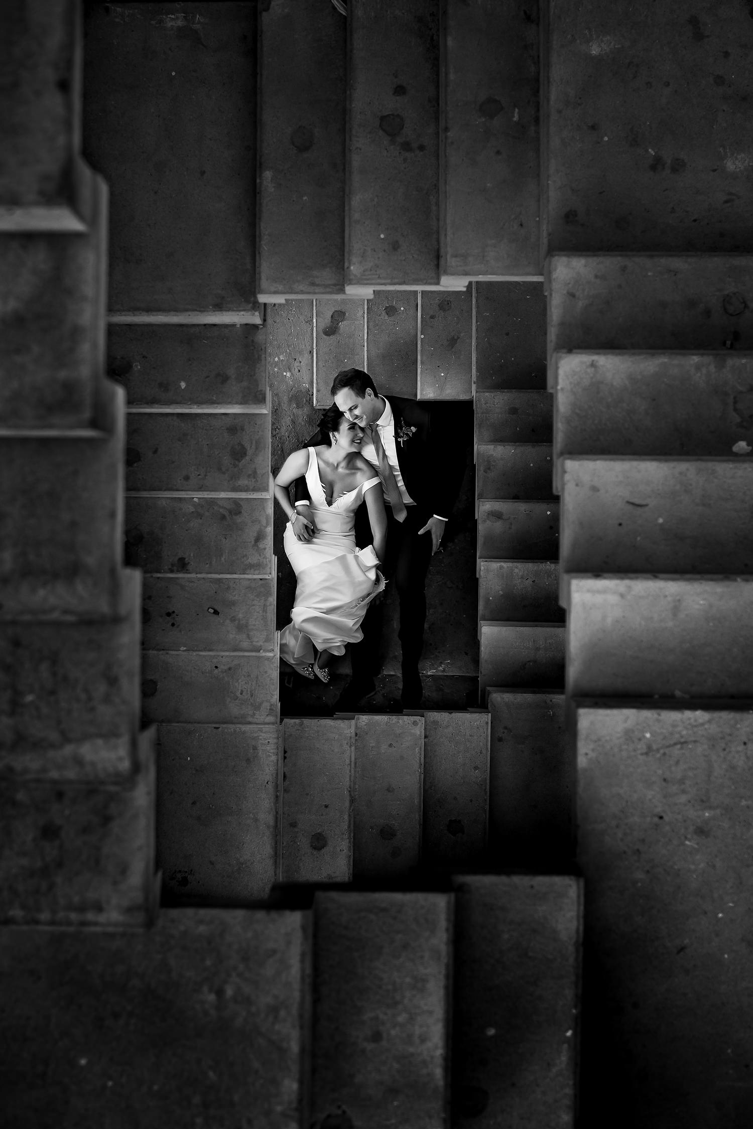 Creative couple wedding portrait using a staircase by wedding photographer in South Africa, Niki M Photography