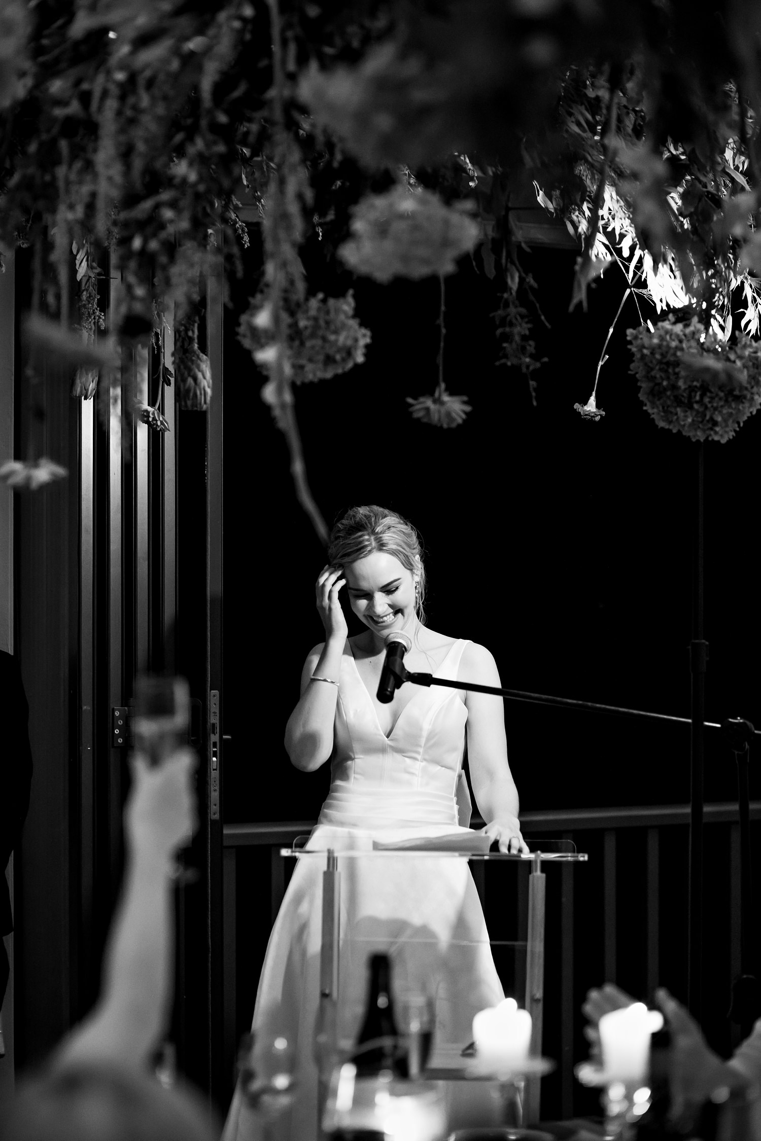 A guest toasts the bride during her speech about grace and gratefulness by wedding photographer in South Africa, Niki M Photography