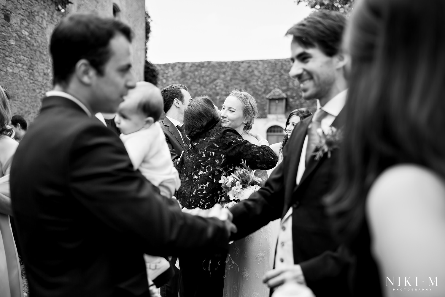Couple are congratulated after their marriage ceremony at Chateau de la Bourlie Dordogne Wedding