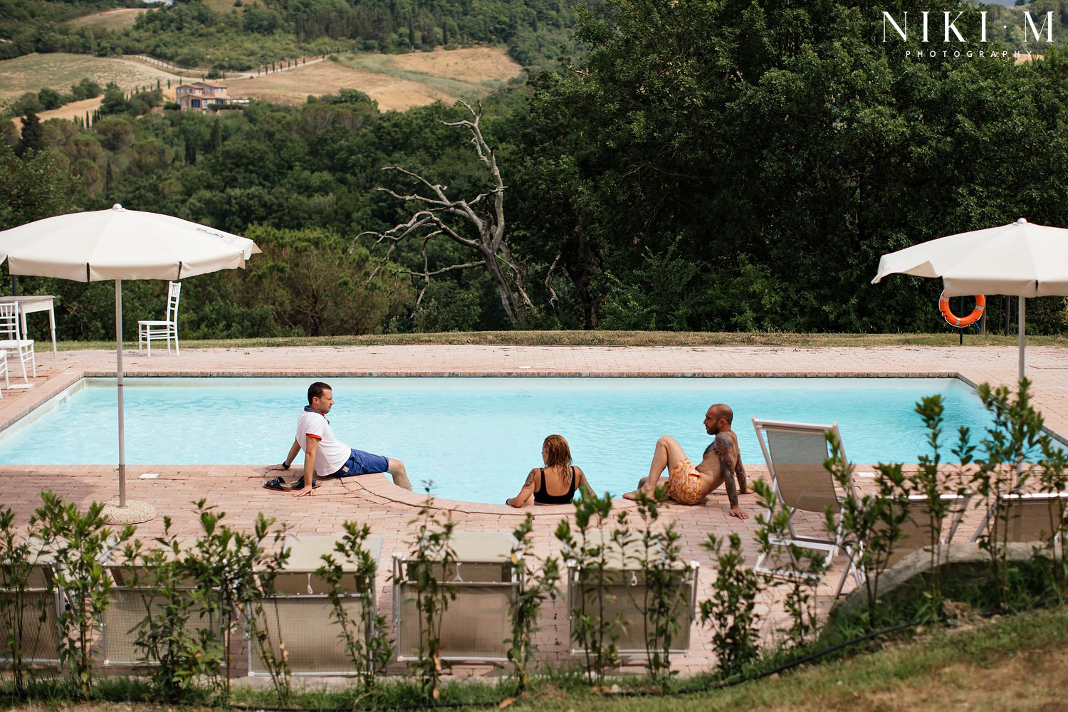 Guests hang out at Villa Ricrio before their friend's Tuscany wedding