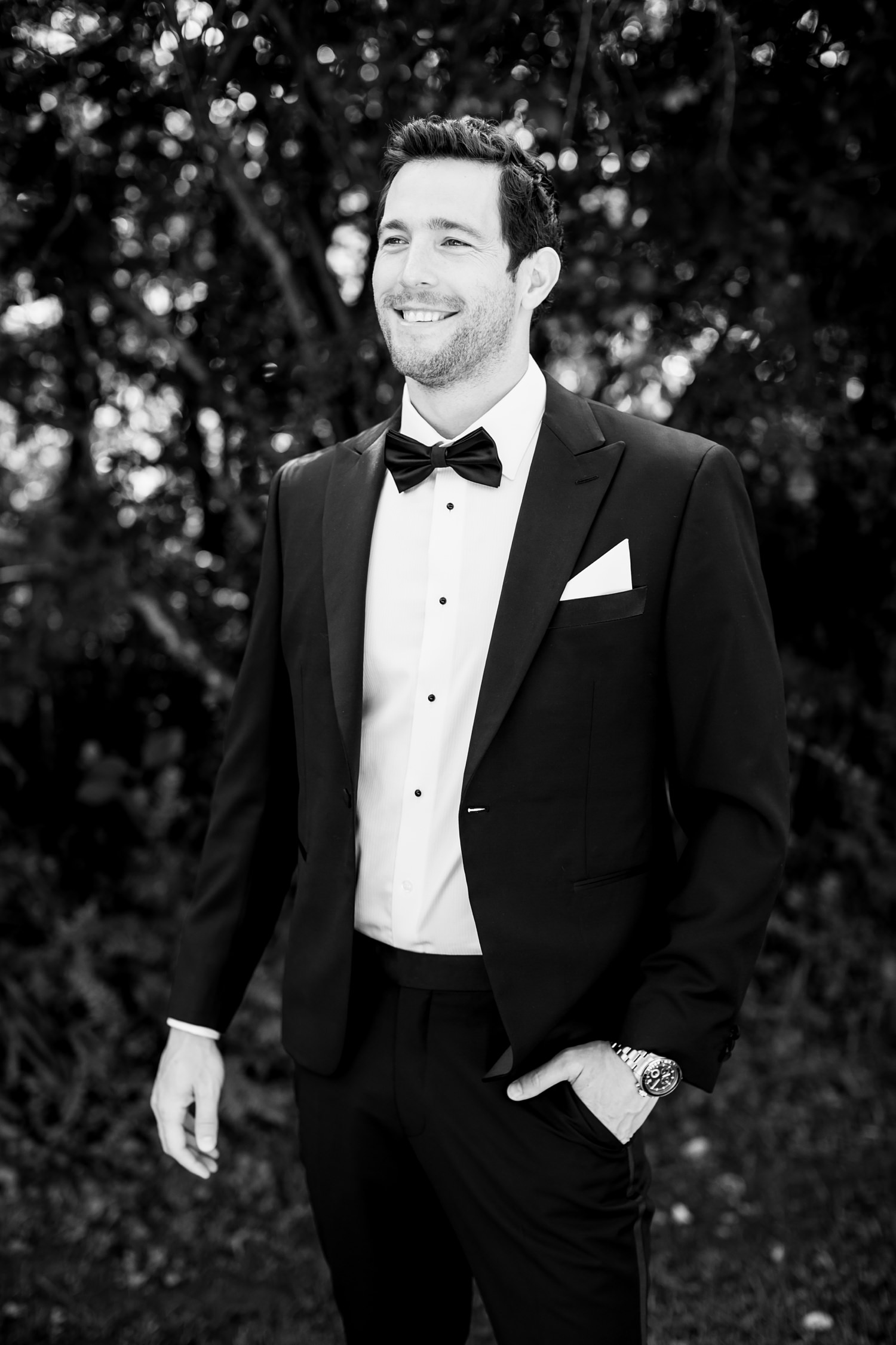 Black and white portrait of Olympic swimmer Brad Tandy on his wedding day at the Central Drakensberg wedding venue, Champagne Sports Resort