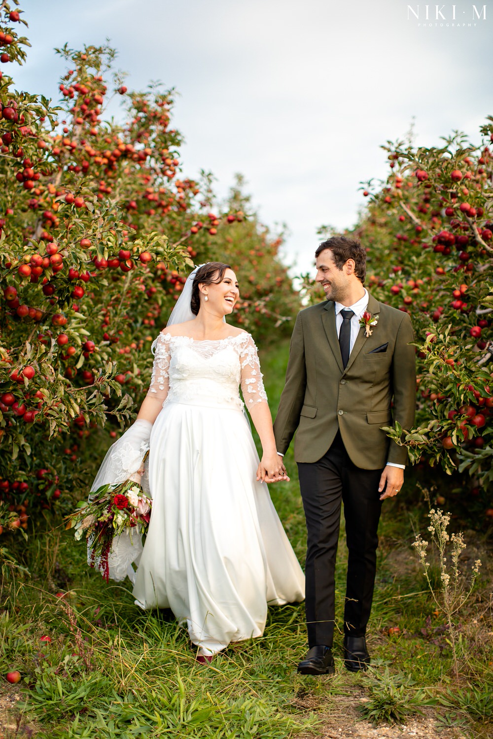 Elgin Wedding at Cherry Glamping with couple photos in an apple orchard