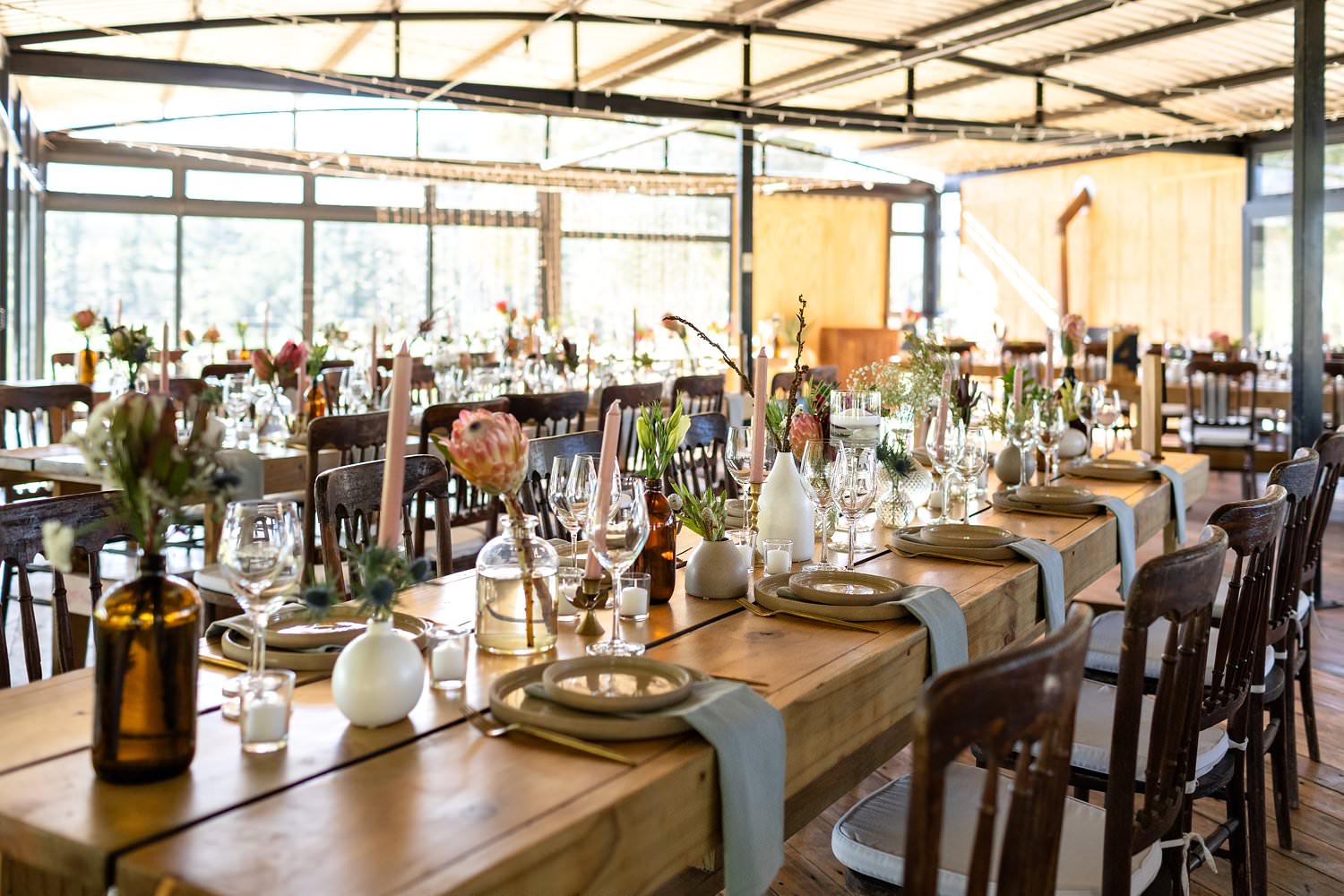 Rustic decor with indigenous South African flowers light up Cherry Glamping at their Elgin wedding venue