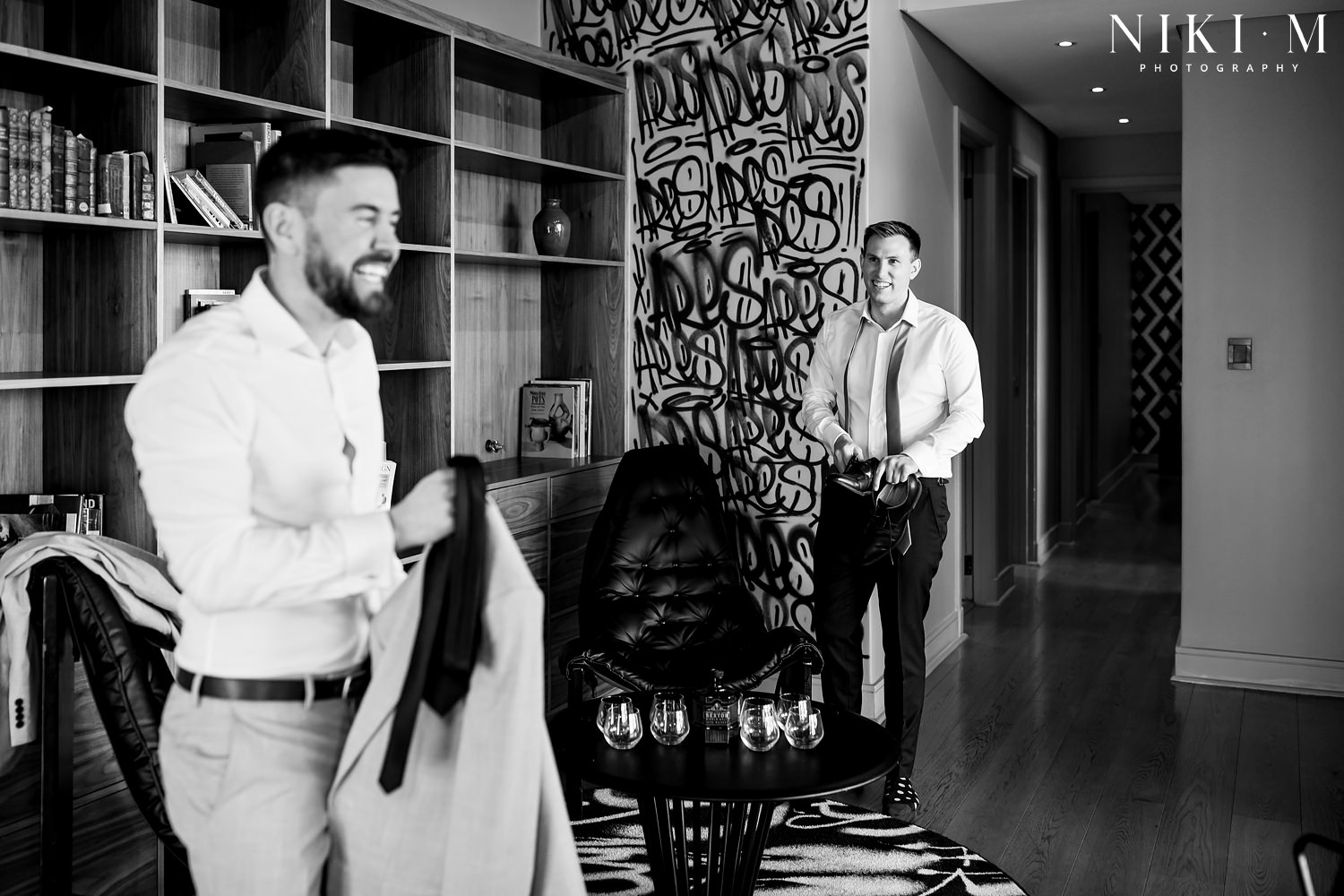 Grooms prep in the penthouse suite at Hallmark House hotel for a Johannesburg wedding