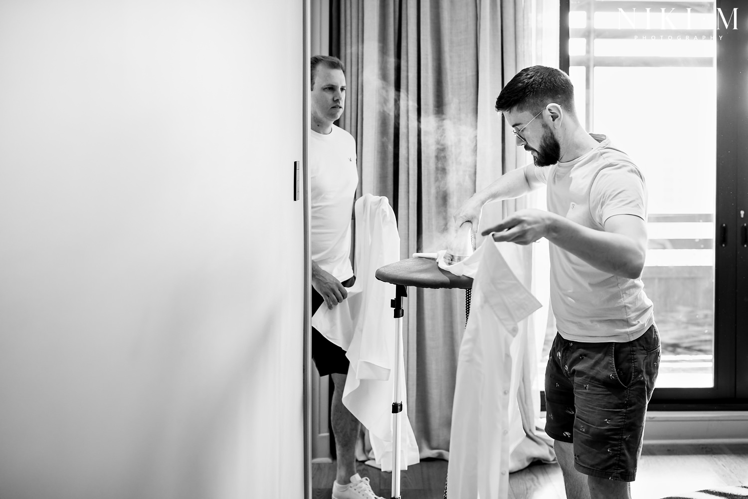 Grooms prep in the penthouse suite at Hallmark House hotel for a Johannesburg wedding