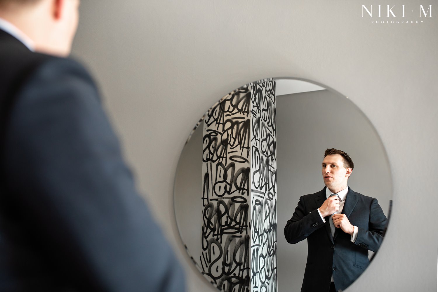 Grooms prep in the penthouse suite at Hallmark House hotel for a Johannesburg wedding