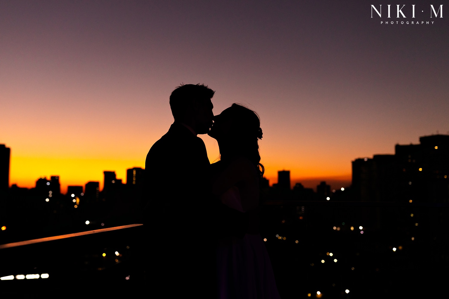 Couple wedding photos overlooking the Johannesburg city skyline at Hallmark House Hotel
