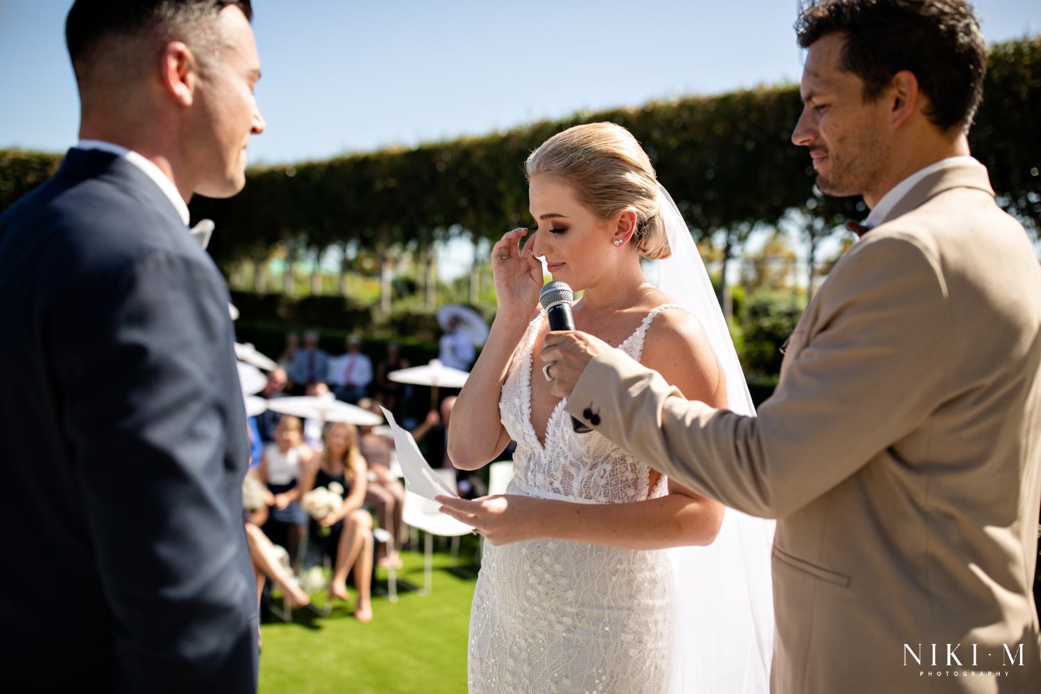Cavalli Estate wedding in the sunken garden with white rose floral arch