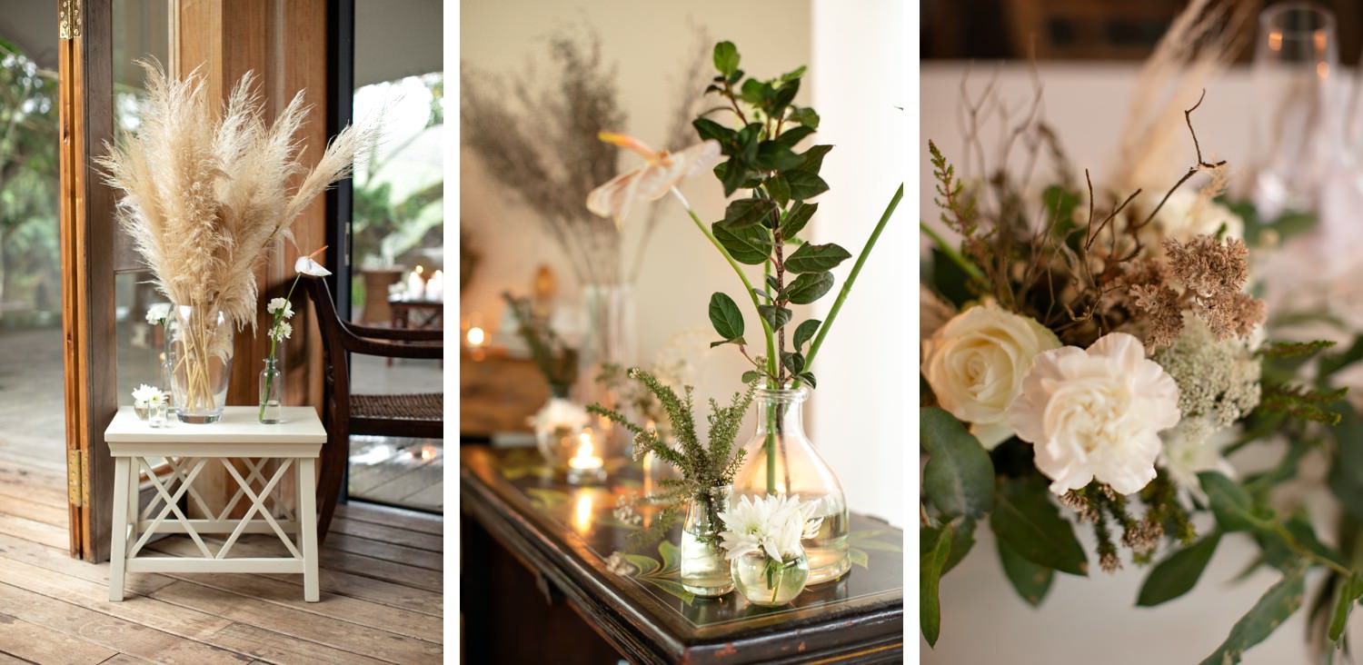 Pampas grass and rose focal pieces at a wedding