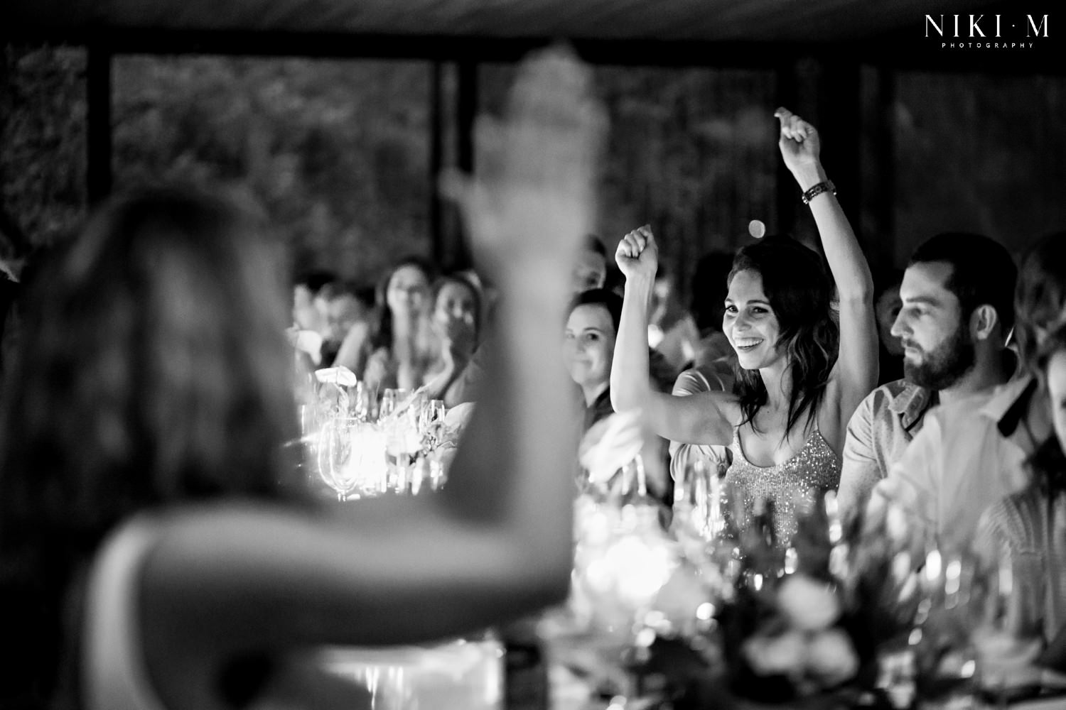 The bride and her sister cheer about a job well done, during the speeches at this wedding in the Crags, South Africa. This article (how to plan your DIY wedding) dives in to how you can ask your family for help at your own DIY wedding.