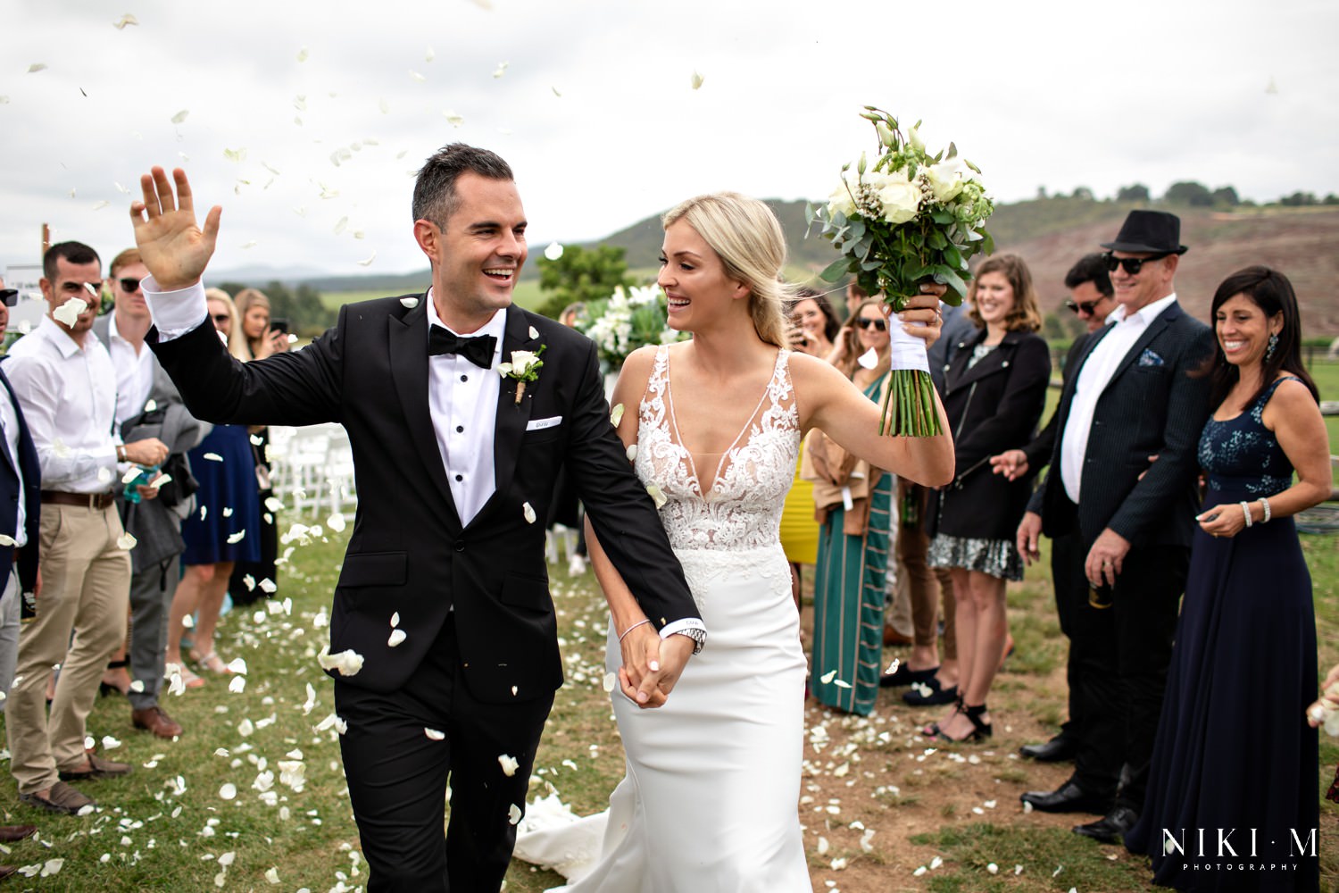 Formal black-tie dress for an outdoor wedding.