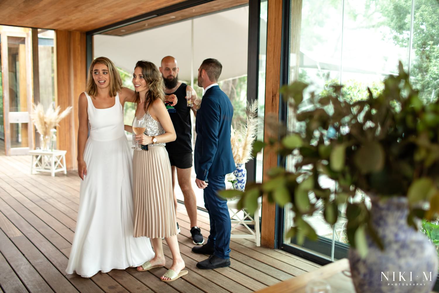 Luke and Lexi gasp as they enter their reception venue for the first time and see what Lexi's sister has created for them. This article (how to plan your DIY wedding) dives in to how you can ask your family for help at your own DIY wedding.