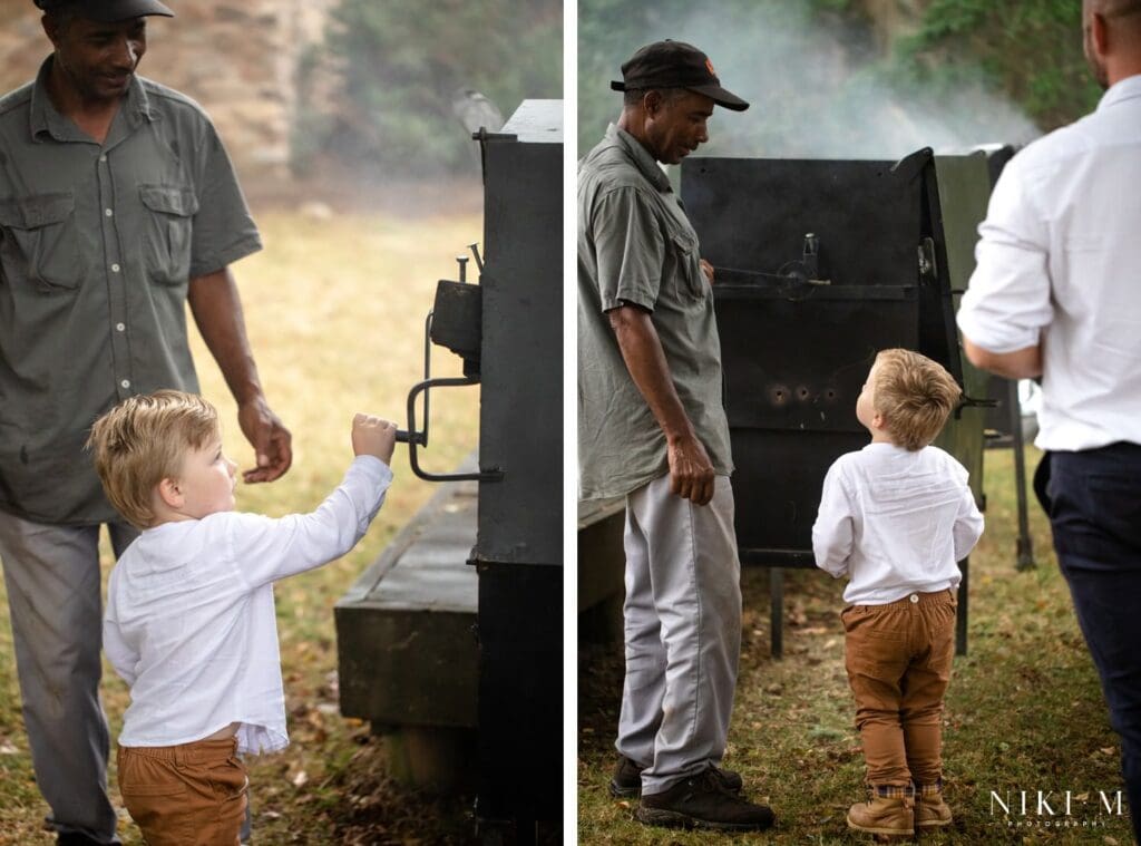 A child takes a second to turn the spit braai at this DIY wedding in the Garden Route