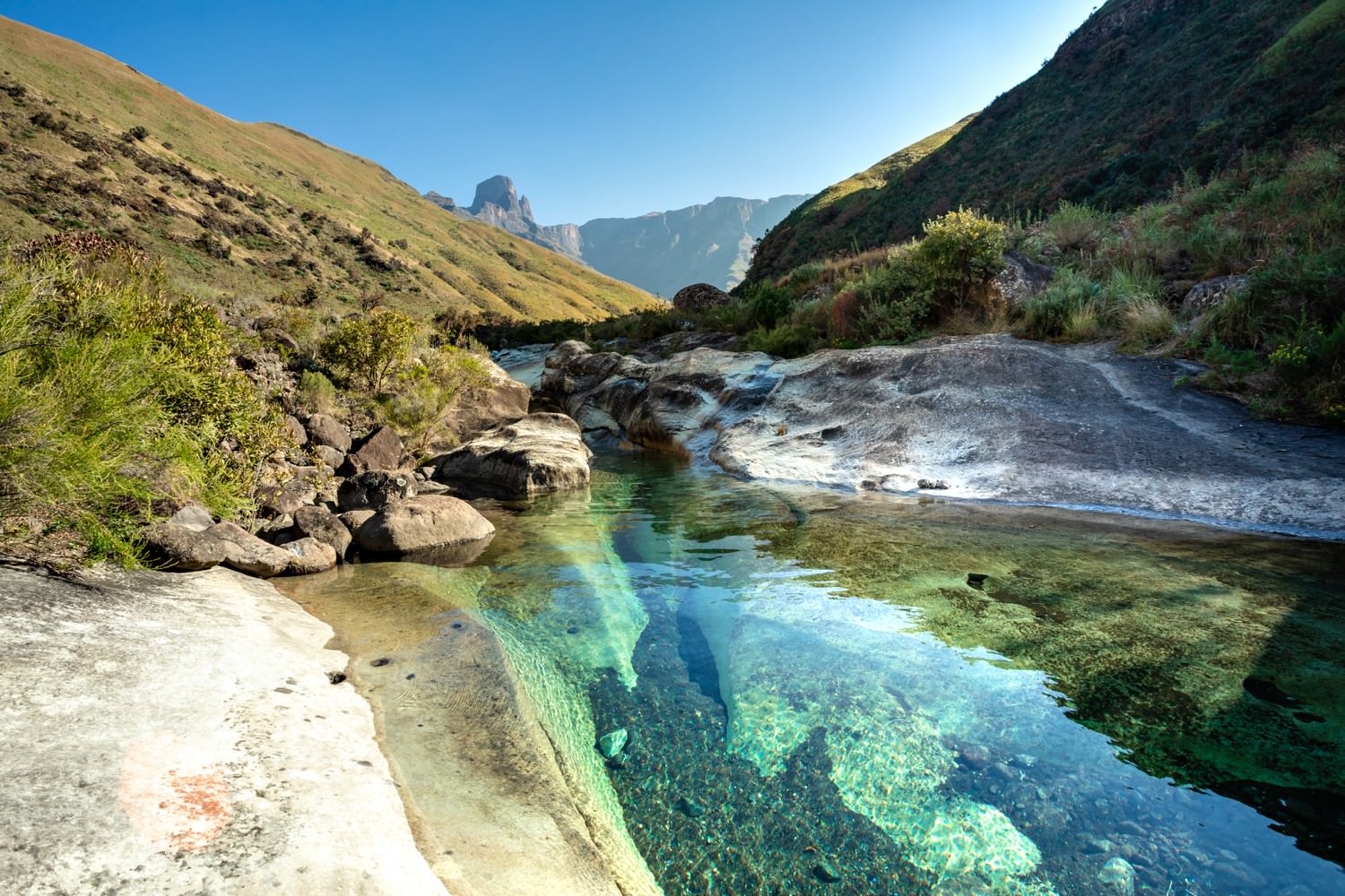 The azure waters of the marble baths in the Drakensberg, accessible by hiking from Injisuthi.