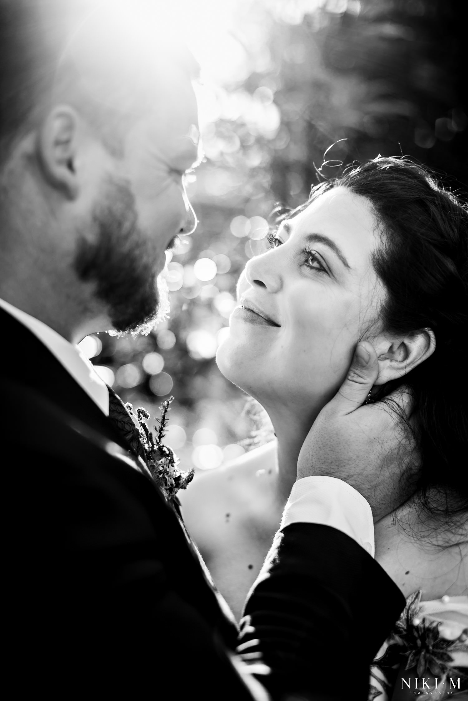 Close-up black and white portrait of bride and groom gazing lovingly into each other’s eyes, captured in soft natural light during their Drakensberg Micro-Wedding photoshoot.