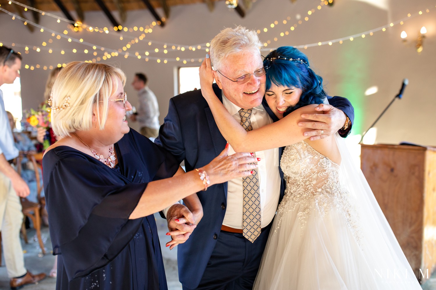 Bride embracing her parents after the ceremony at a Champagne Valley Drakensberg wedding