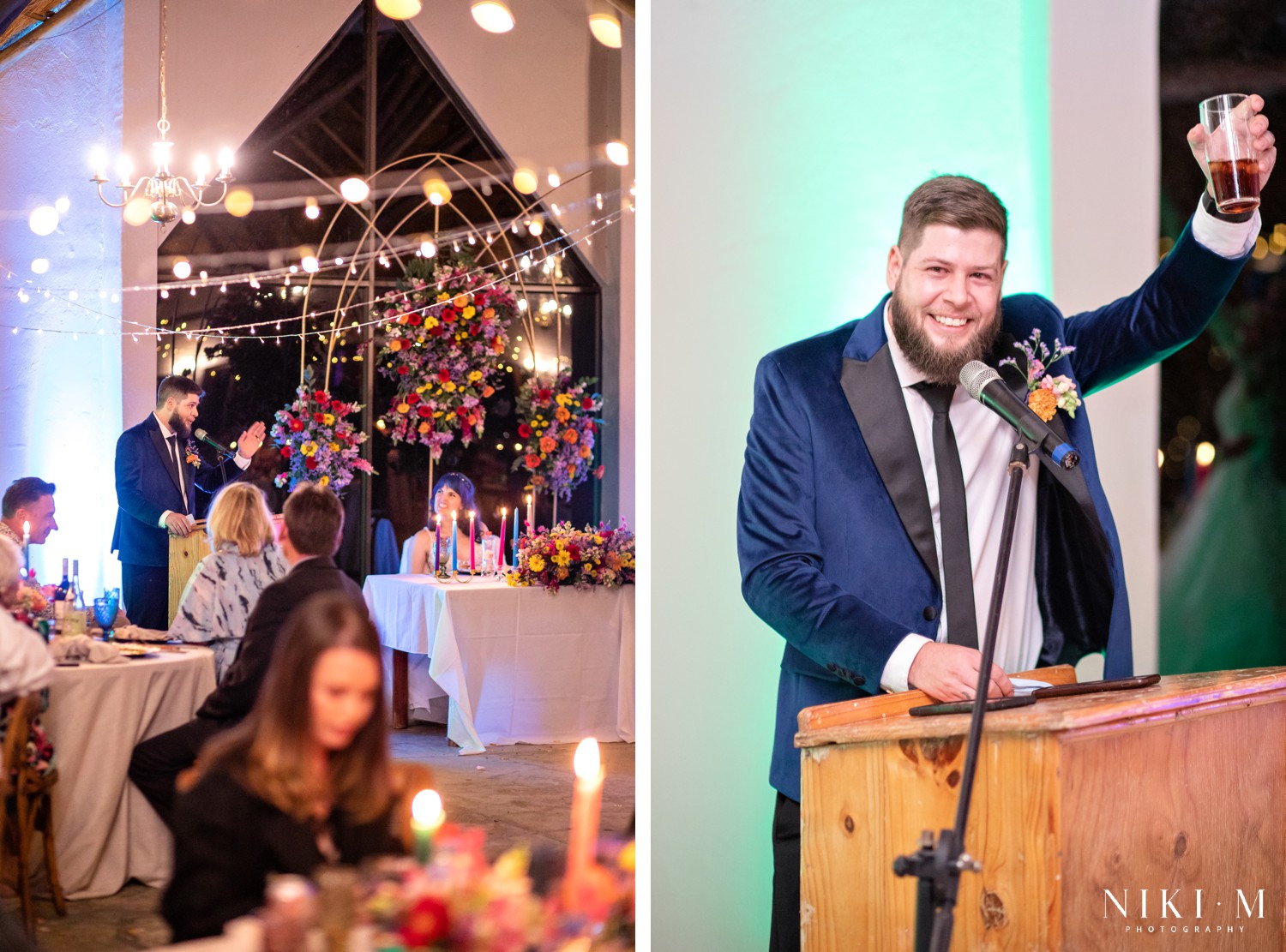 Wide reception room with speaker at the podium and a colourful wildflower arch at a Champagne Valley wedding