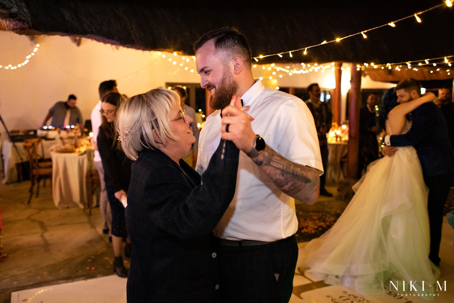 Brother dancing with his mom during the reception at a Champagne Valley wedding in the Drakensberg